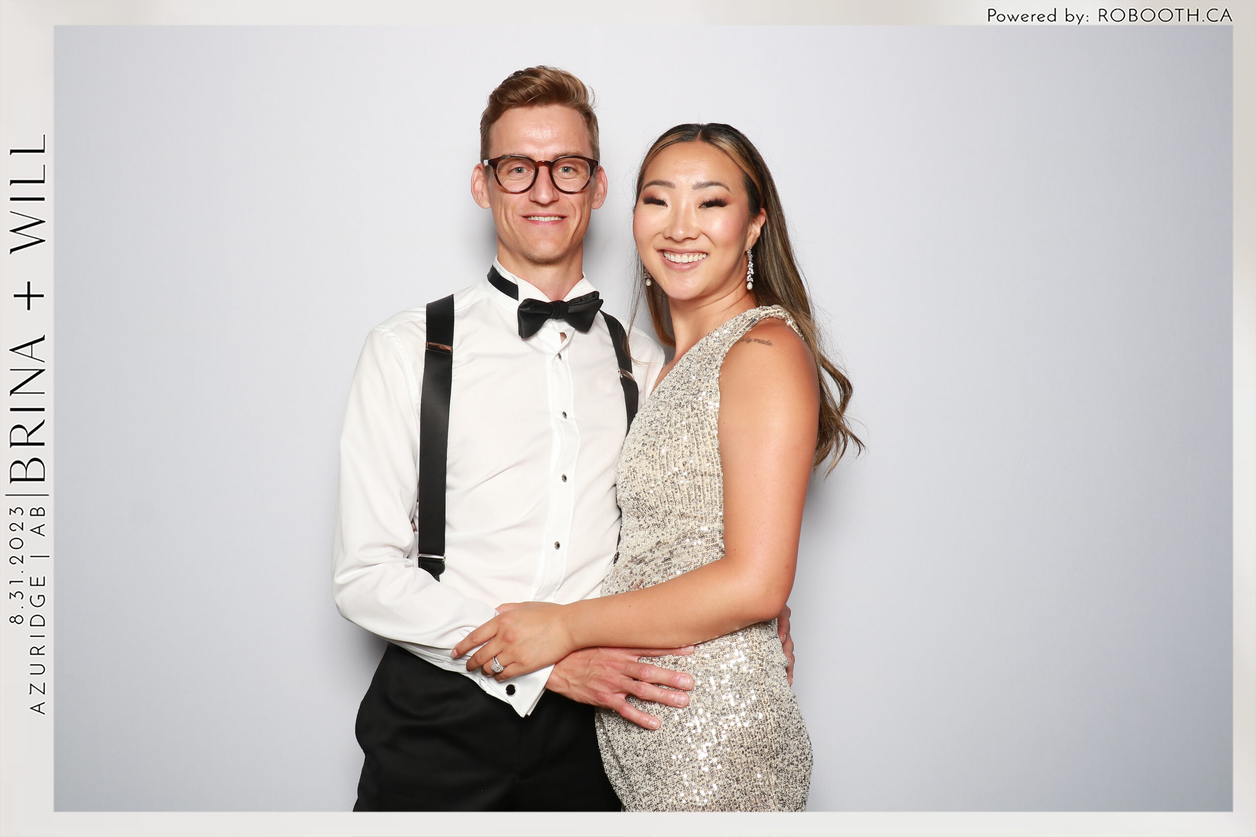 black and white photo of a couple in the photo booth in Calgary