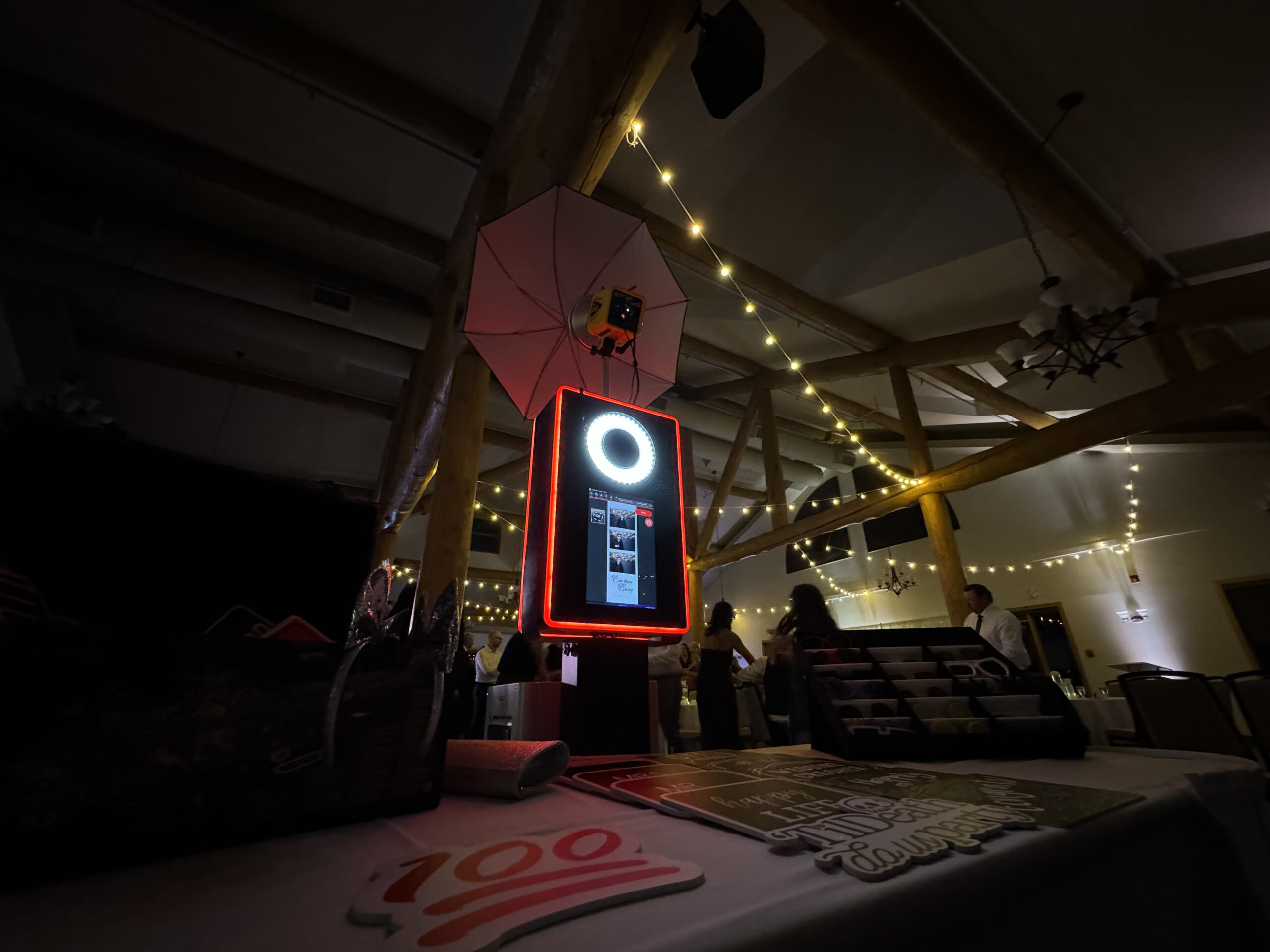 Elegant wedding photo booth setup with backdrop and props in Calgary, Alberta