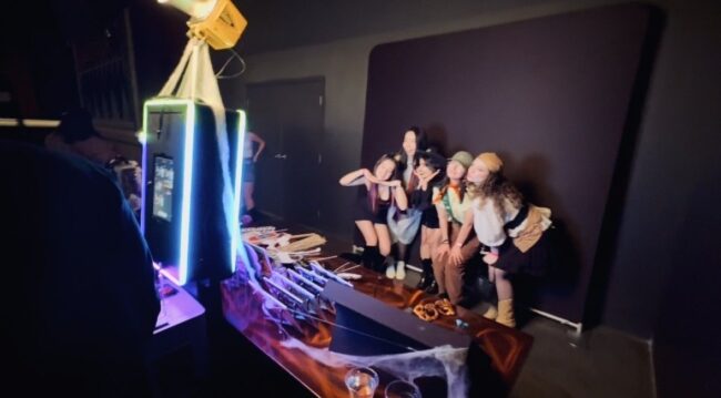 Group of friends enjoying photo booth poses at an event in Calgary Alberta